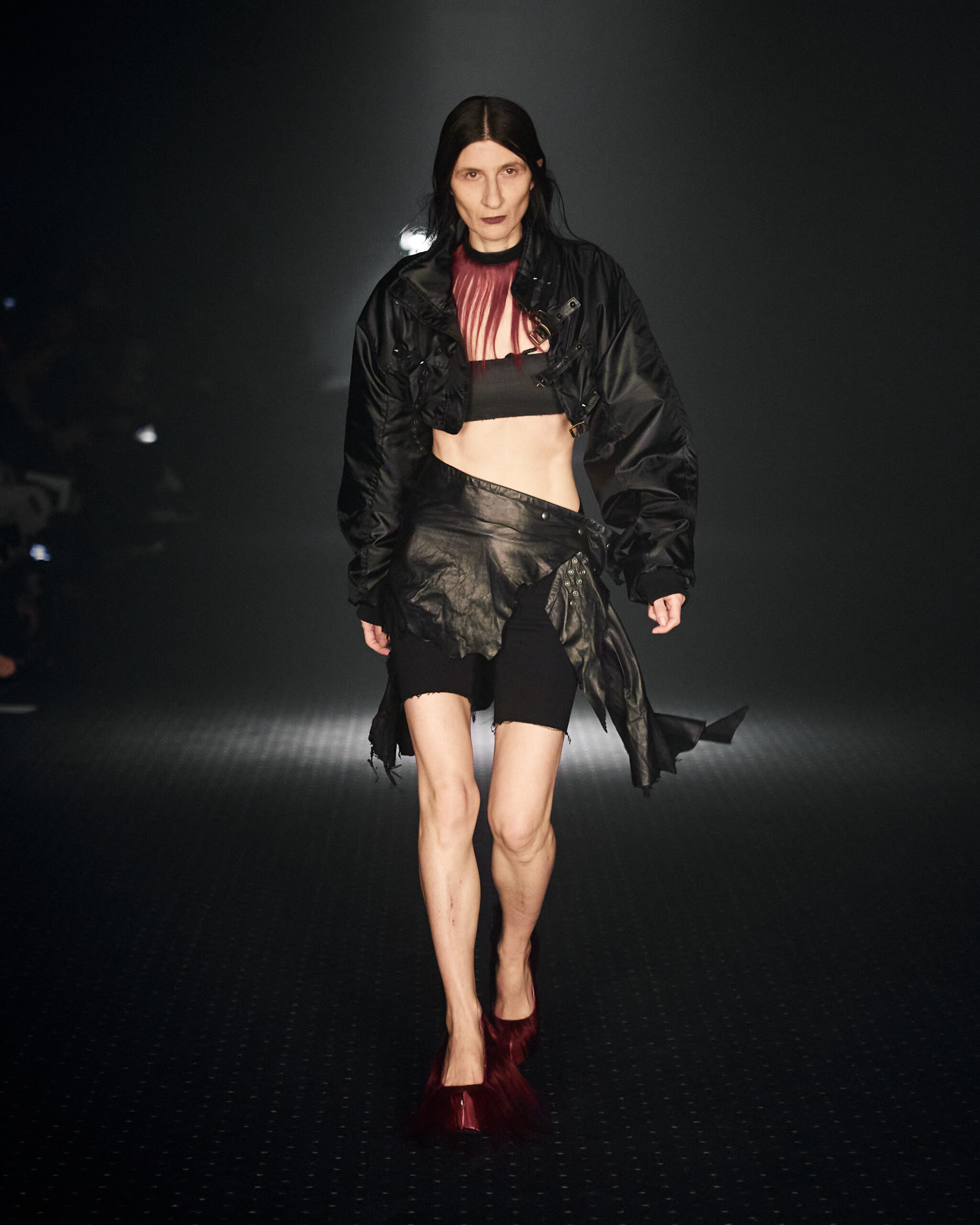 Ayse Dudu Tepe walking for P.L.N wearing black jacket, tank top and mini skirt during Copenhagen Fashion Week AW23