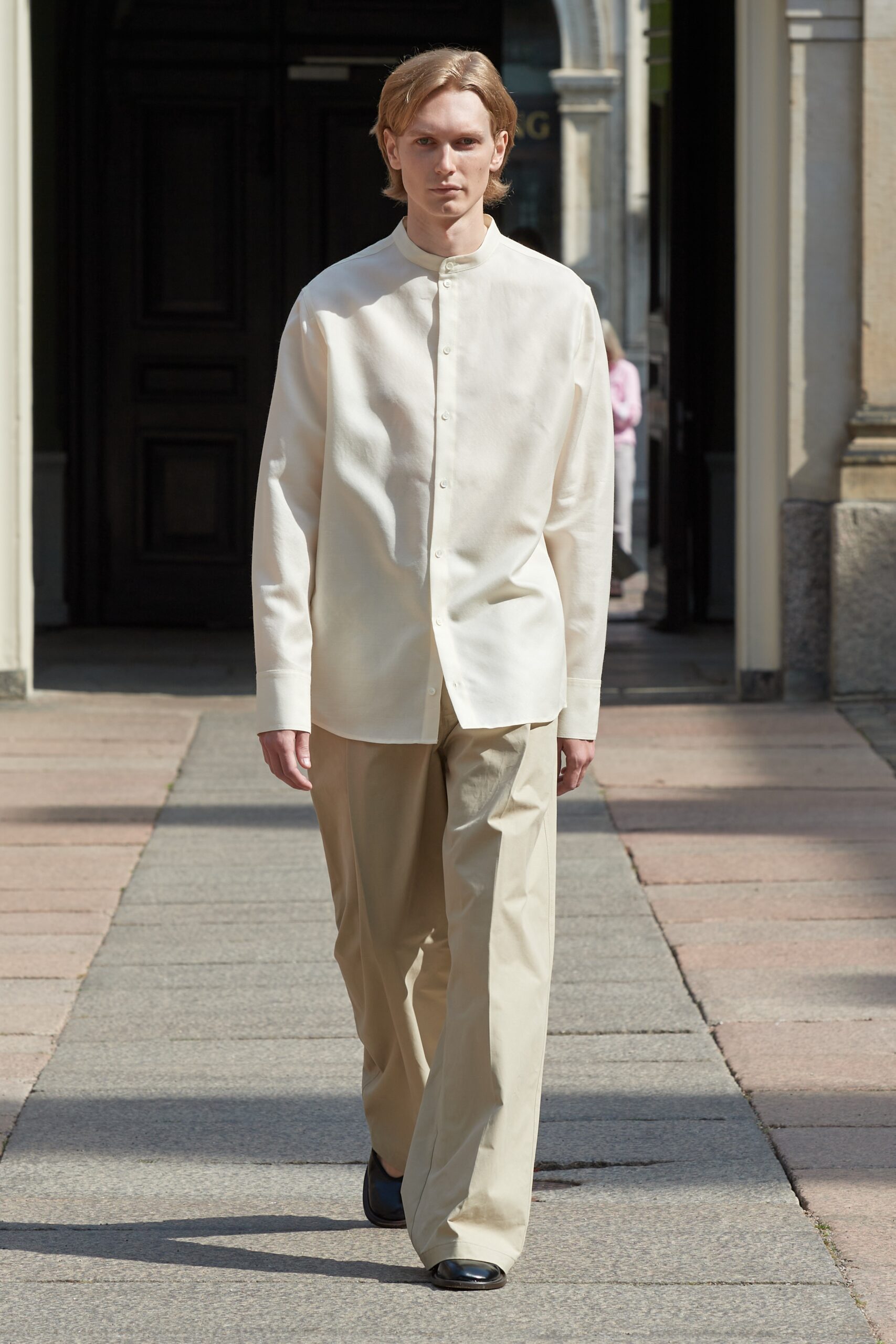 Model wearing Mark Kenly Domino Tan SS25 during Copenhagen Fashion Week