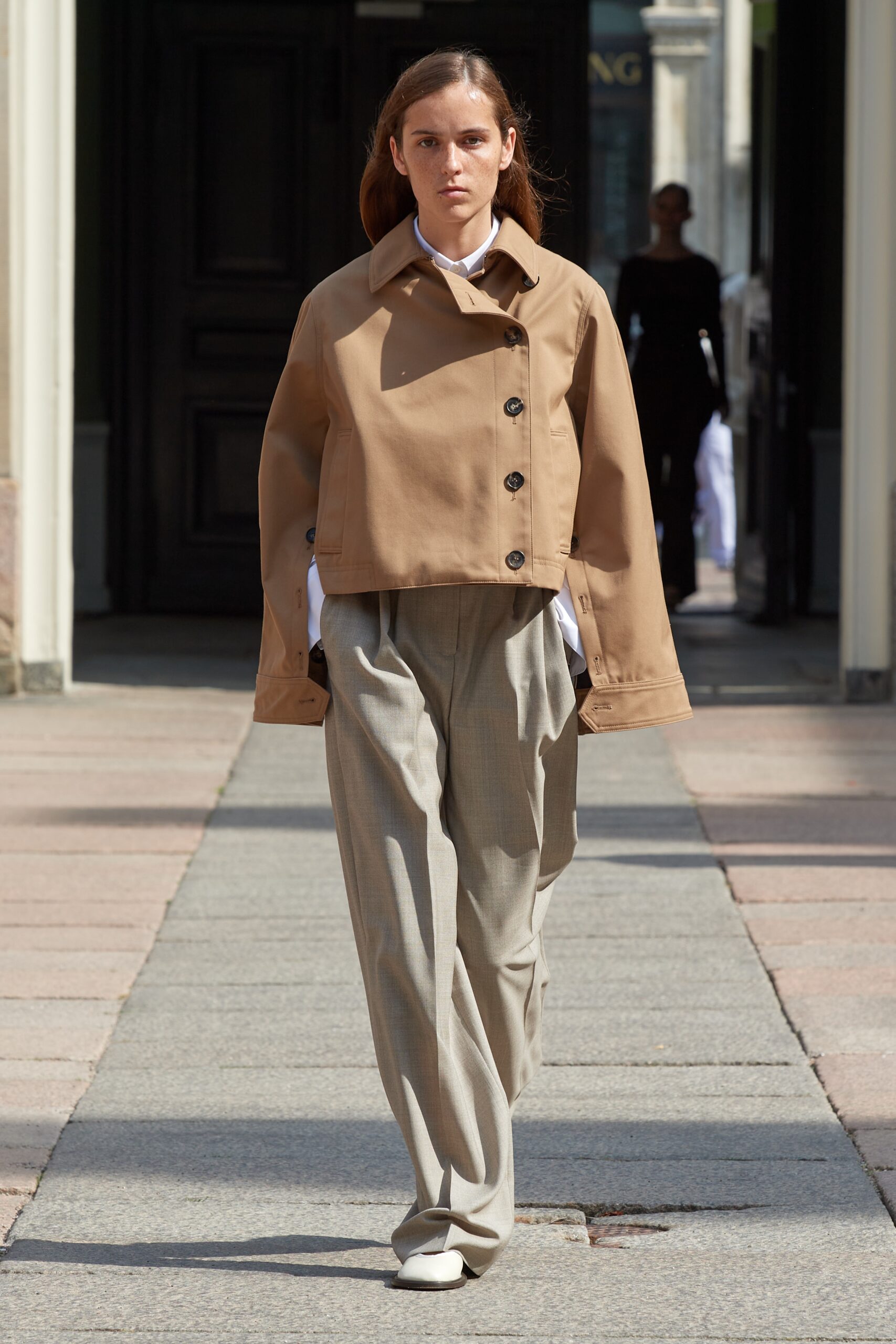 Model wearing Mark Kenly Domino Tan SS25 during Copenhagen Fashion Week