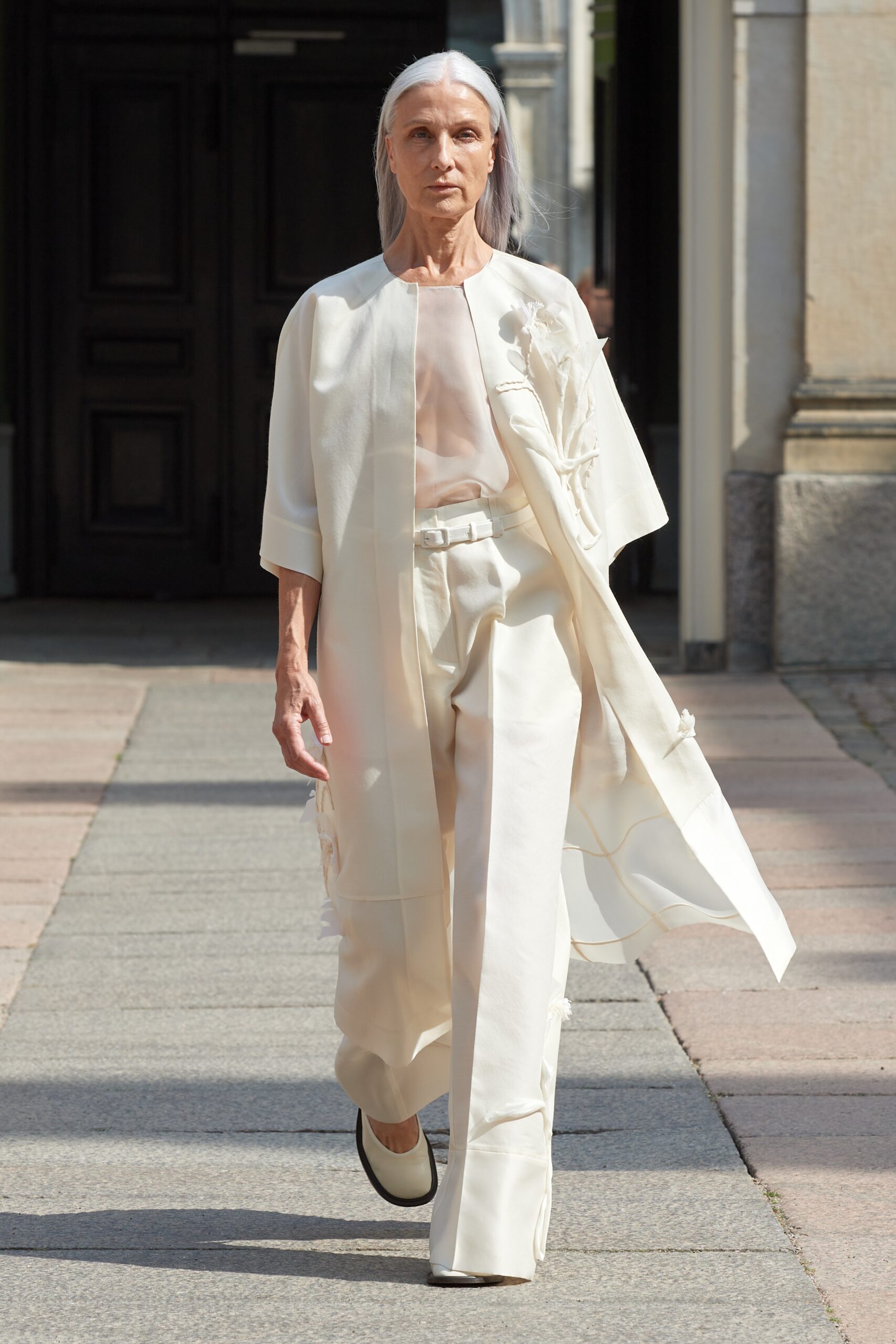 Model wearing Mark Kenly Domino Tan SS25 during Copenhagen Fashion Week