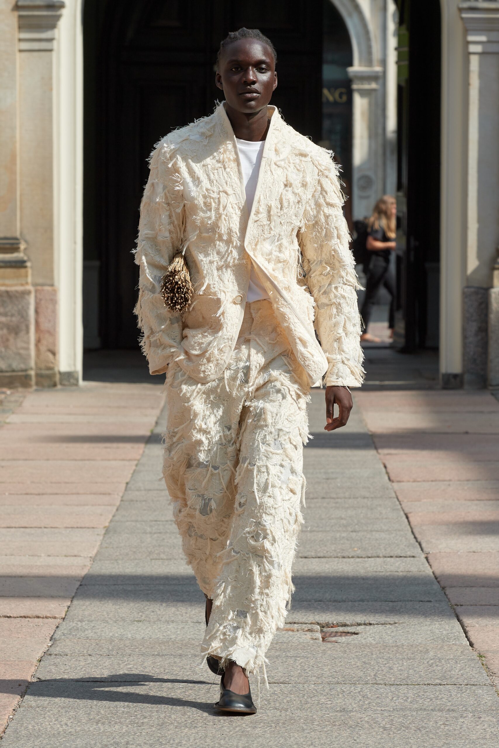 Model wearing Mark Kenly Domino Tan SS25 during Copenhagen Fashion Week