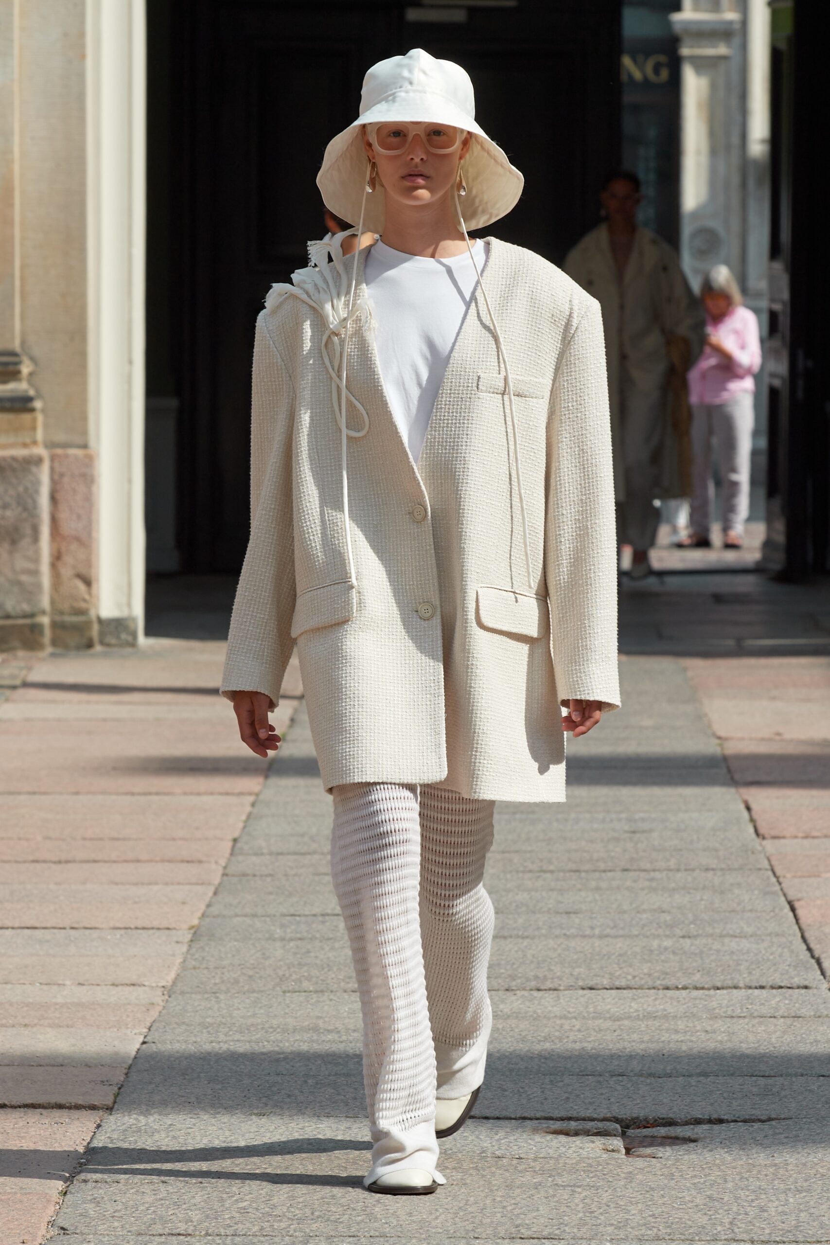 Model wearing Mark Kenly Domino Tan SS25 during Copenhagen Fashion Week